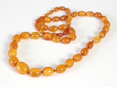 Lot 458A - An amber necklace, formed from a single row of...