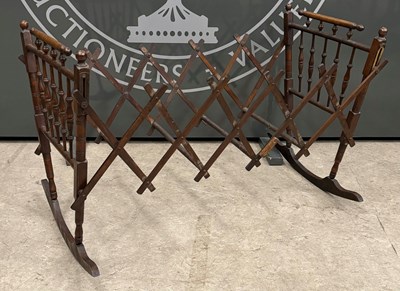 Lot 872 - An antique folding crib / cot, 70.5cm high.