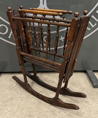 Lot 872 - An antique folding crib / cot, 70.5cm high.