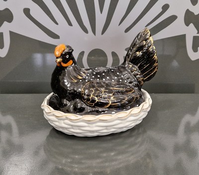 Lot 455 - A Victorian pottery nesting hen, the base with...