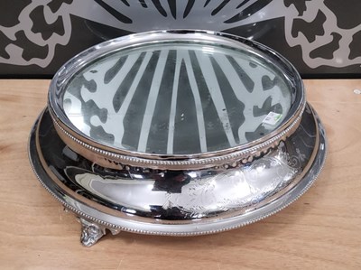 Lot 487 - A large EPNS circular cake stand, centred with...