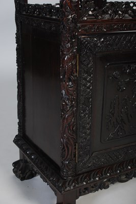 Lot 82 - A late 19th century Chinese dark wood open...