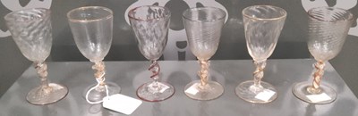 Lot 26 - A set of six clear and coloured sherry glasses,...