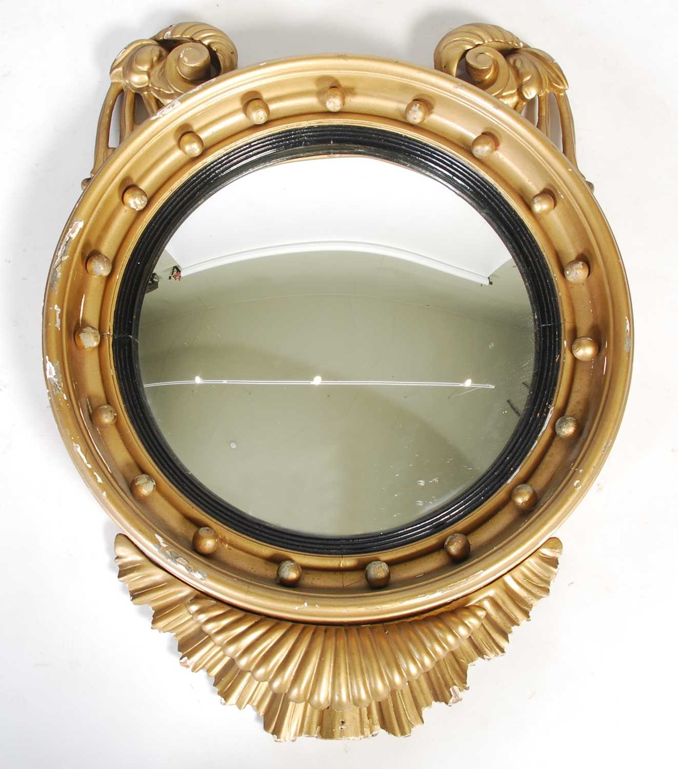 Lot 91 - A Regency style giltwood convex wall mirror,...