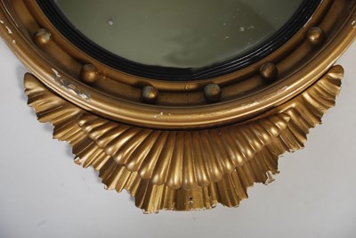 Lot 91 - A Regency style giltwood convex wall mirror,...