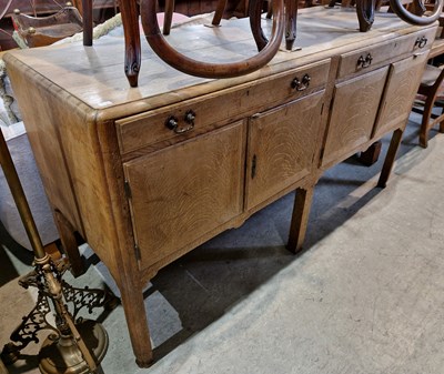 Lot 778 - An antique oak extending dining table, the...