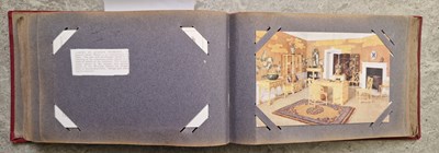 Lot 387 - A vintage postcard album containing 'Tuck's'...