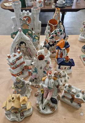 Lot 512 - A collection of antique Staffordshire figures...