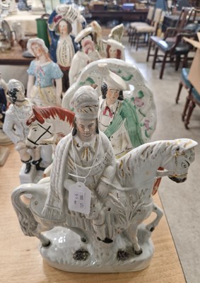 Lot 515 - A group of Staffordshire figures to include...