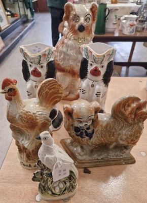 Lot 516 - A collection of Staffordshire figures to...