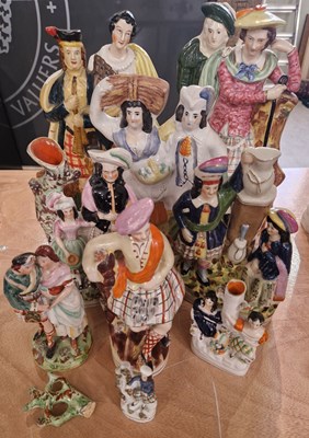 Lot 518 - A group of Staffordshire ceramic figures,...