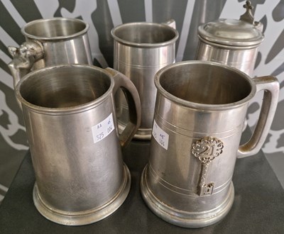 Lot 546 - A group of five pewter tankards to include one...