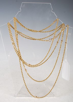 Lot 46 - A long yellow metal guard chain of rope twist...