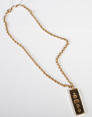 Lot 47 - A 9ct gold necklace suspending a 9ct gold...