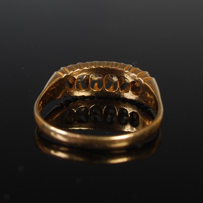 Lot 60 - An 18ct gold and diamond six stone ring, size...