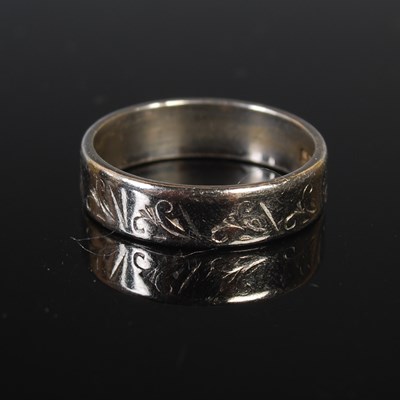 Lot 66 - A platinum ring, size N, 6 grams.