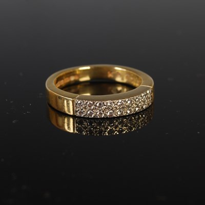 Lot 68 - An 18ct gold and diamond ring set with two...