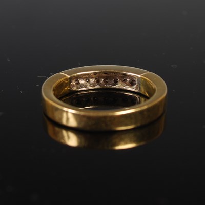 Lot 68 - An 18ct gold and diamond ring set with two...