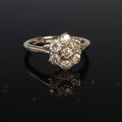 Lot 84 - A white metal and diamond cluster ring,...