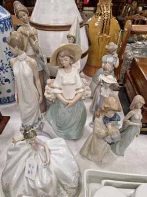 Lot 580 - A group of six Lladro female figures with...