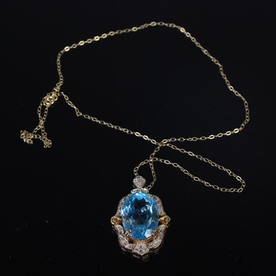 Lot 37E - A 9ct gold and topaz set pendant suspended on...
