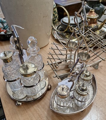 Lot 594 - A silver plated toast / egg stand with two...