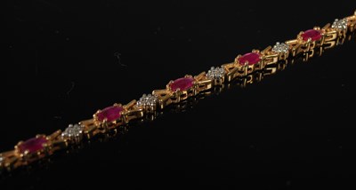 Lot 37 - A 9ct gold, ruby and diamond set articulated...