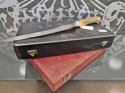 Lot 562 - Two cased sets of six horn-handled knives and...