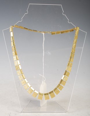 Lot 87 - A 1970's style rolled gold rectangular...