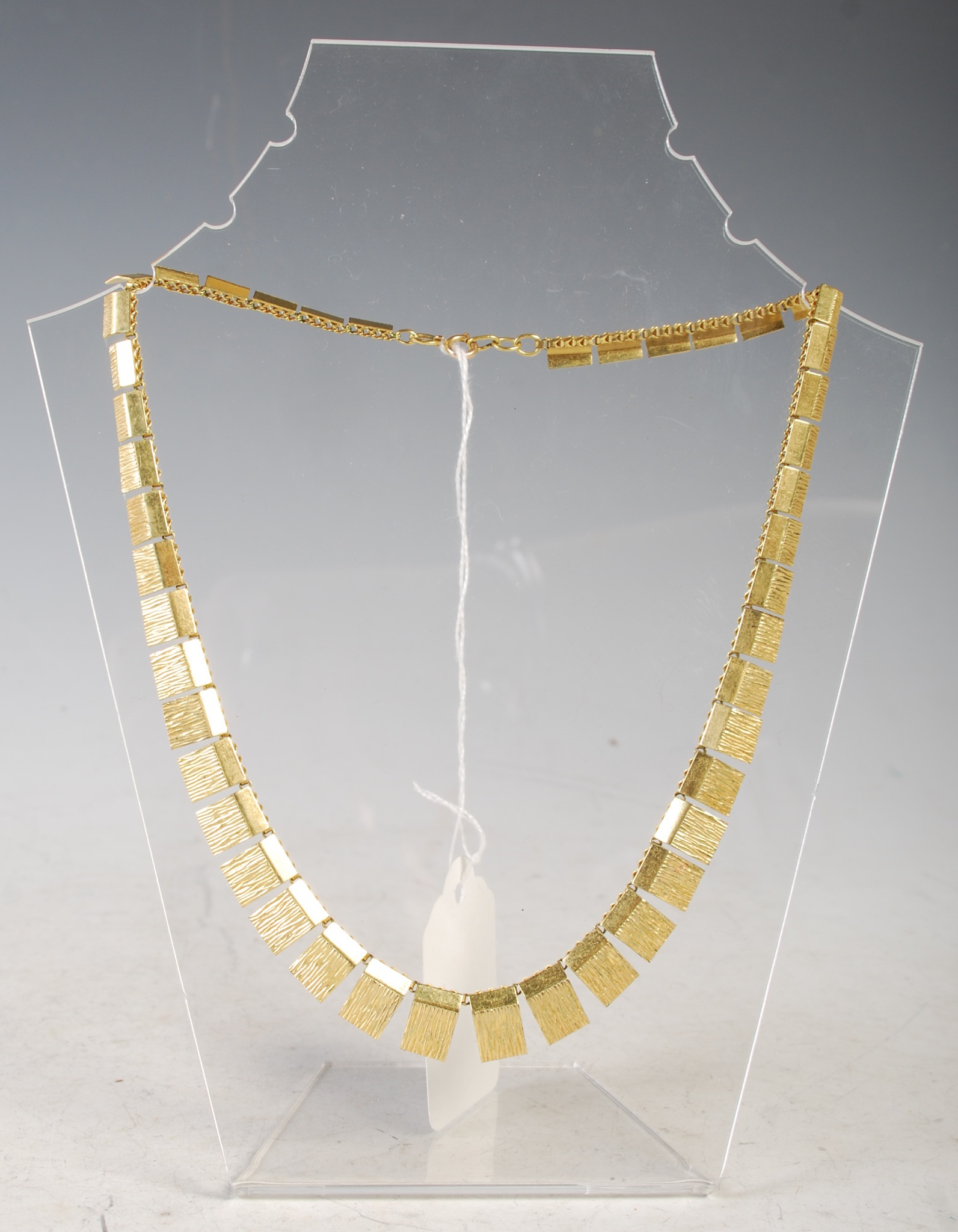 Lot 87 - A 1970's style rolled gold rectangular