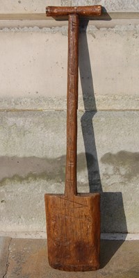 Lot 129 - An antique wooden peat spade, 109cm long