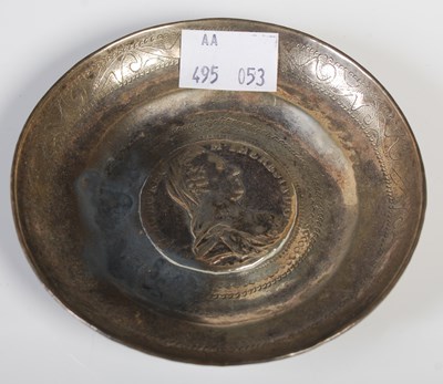 Lot 126 - A white metal coin-set dish, 10cm diameter,...