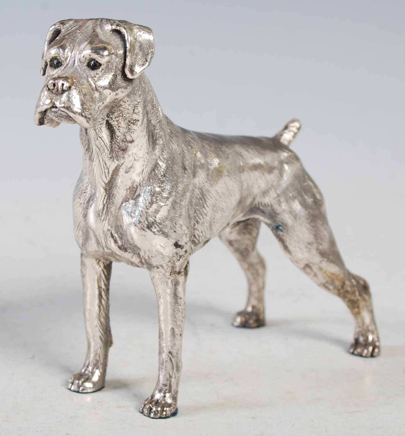 Lot 130 - A filled silver model of a boxer dog,...