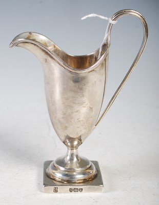 Lot 158 - A George III silver helmet-shaped cream jug,...