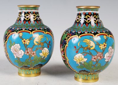 Lot 207 - A pair of Chinese blue ground cloisonne jars,...