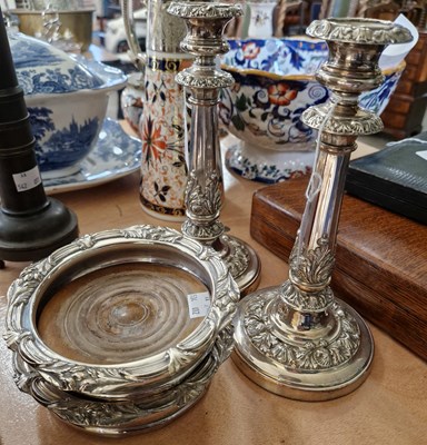 Lot 607 - A pair of silver-plated candlesticks with...