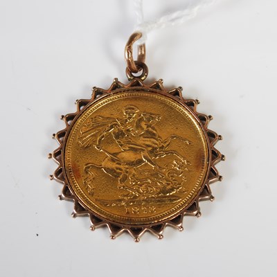 Lot 219 - A Victorian gold sovereign dated 1873 in later...