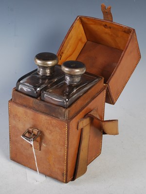 Lot 193 - An early 20th century leather cased two-bottle...