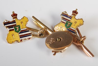 Lot 252 - A pair of yellow metal and enamel cufflinks,...