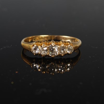 Lot 260 - An 18ct gold and diamond five stone ring, size...