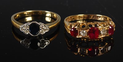 Lot 271 - An 18ct gold, synthetic ruby and diamond five...