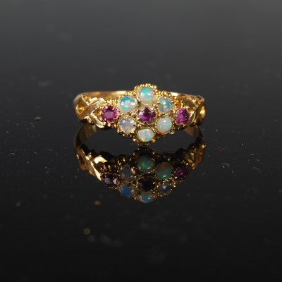 Lot 274 - An 18ct gold, ruby and opal dress ring, size...