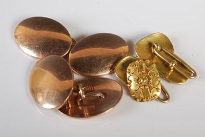 Lot 279 - A pair of yellow metal oval-shaped cufflinks...