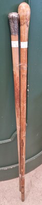 Lot 691 - A white metal mounted walking cane, together...