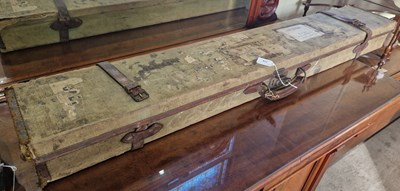 Lot 758 - A canvas and leather bound gun case with...