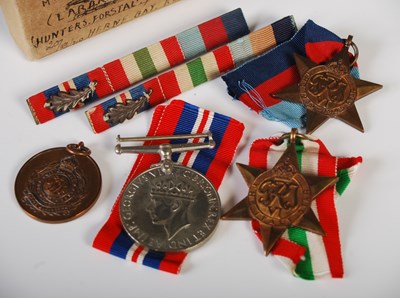 Lot 301 - A group of three Second World War medals to...