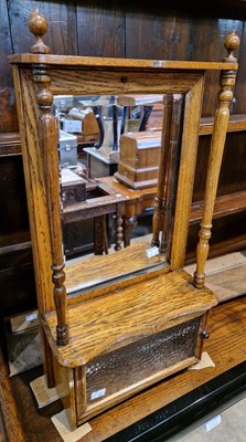 Lot 762 - An antique oak vanity cabinet with bevelled...