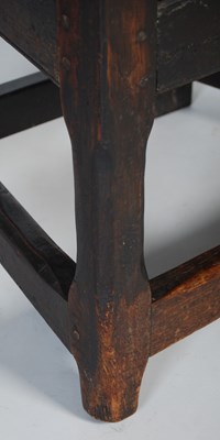 Lot 84 - An 18th century oak wainscot elbow chair, the...