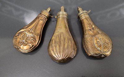 Lot 384 - Three assorted 19th century brass powder...