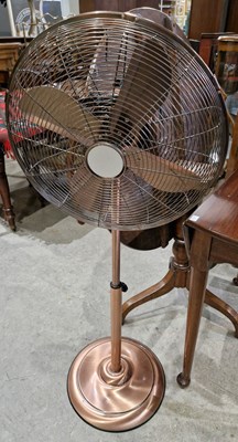 Lot 815 - A Dunelm rose gold coloured floor fan.